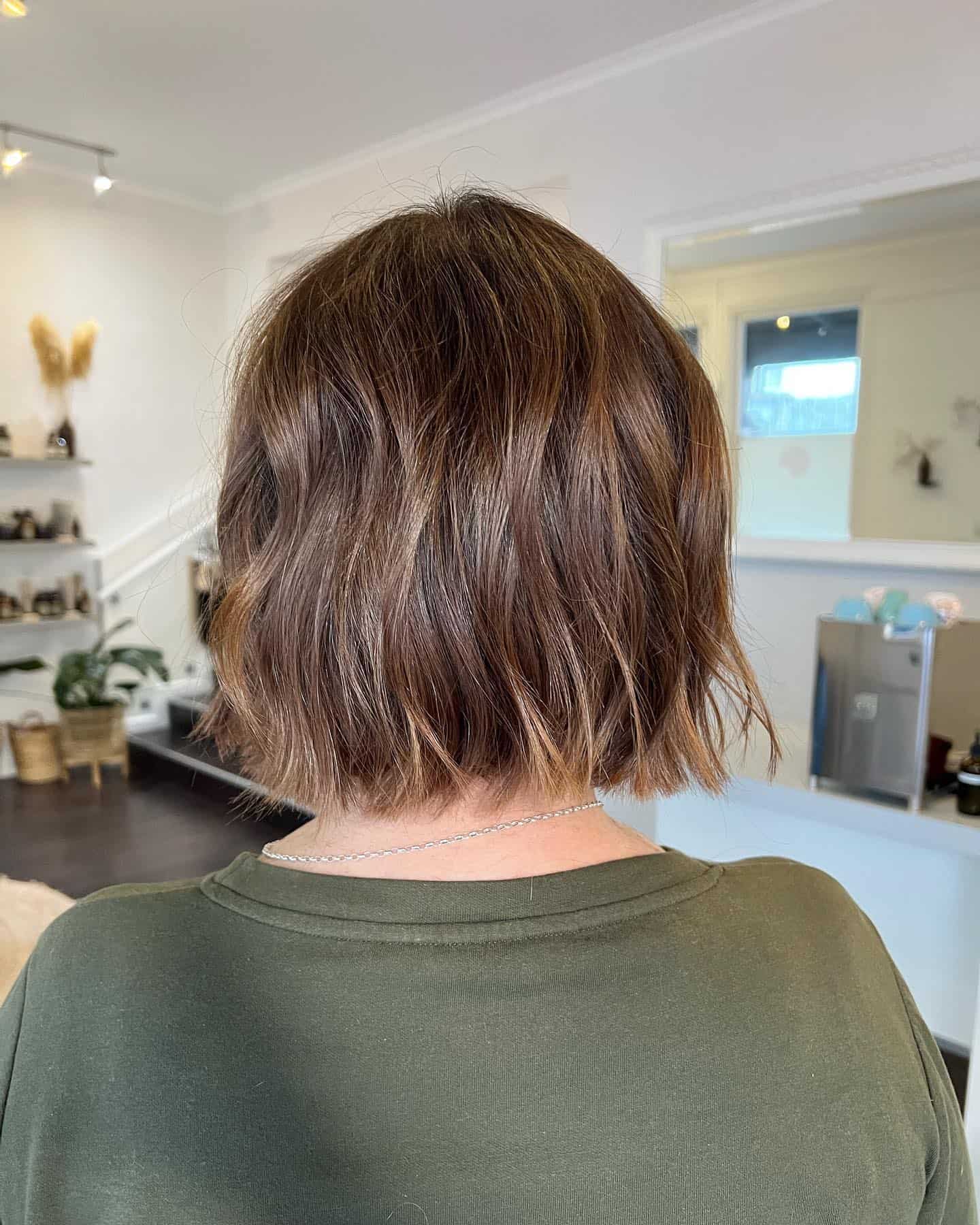 274424486_120615410535149_1016730182136086700_n Brown bixie with blonde highlights