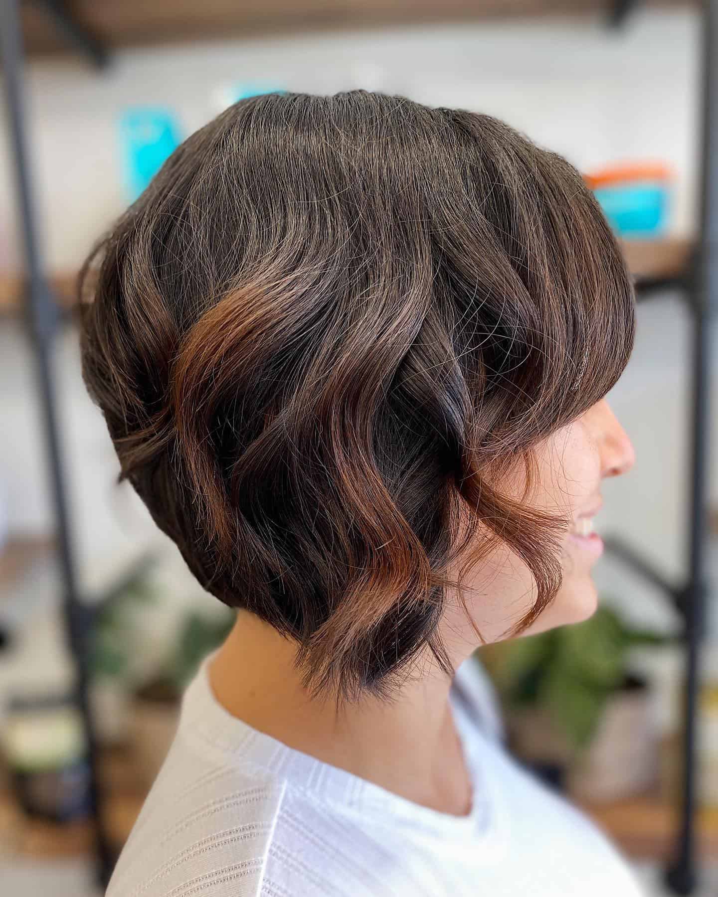 277551739_2106845906163085_4735392611566149882_n Woman with a brown bixie haircut