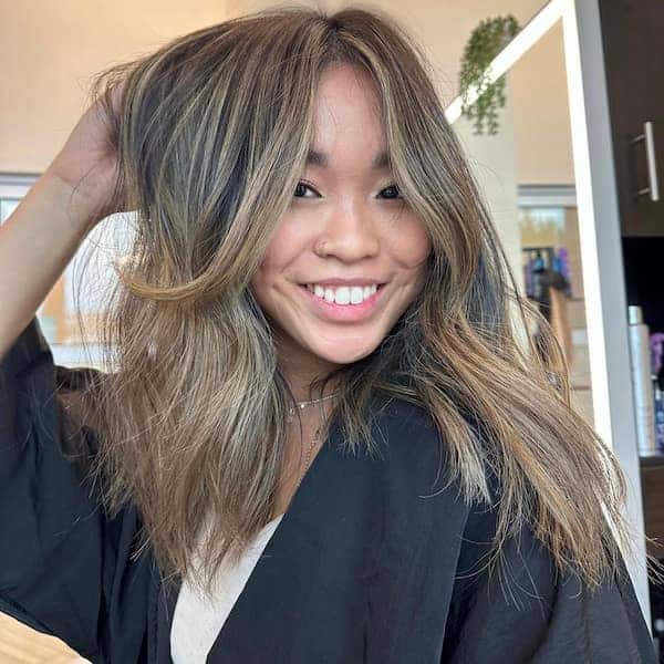 blended-rooty-butterfly-haircut-with-curtain-bangs Blended Rooty Butterfly Haircut with Curtain Bangs
