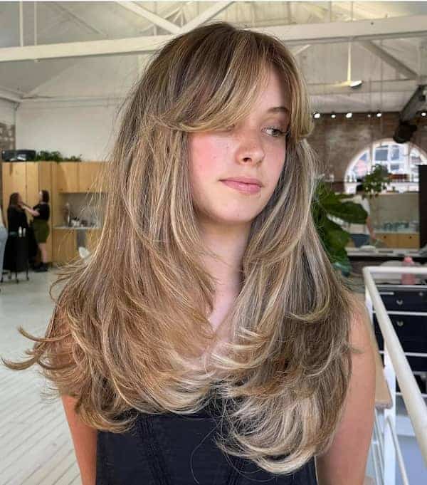 brown-bouncy-blowout-hair-with-curtain-bangs