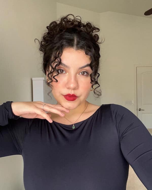 curly-messy-bun-with-tendrils Curly Messy Bun with Tendrils
