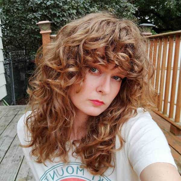 Layered Wavy Haircut with Fringe
