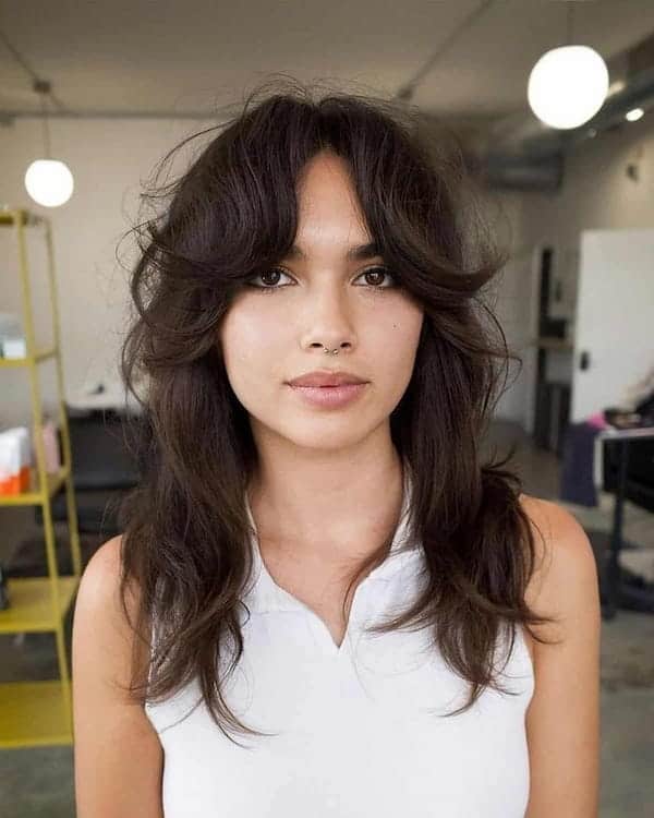 mid-length-shag-haircut-with-feathered-curtain-bangs Mid-Length Shag Haircut with Feathered Curtain Bangs