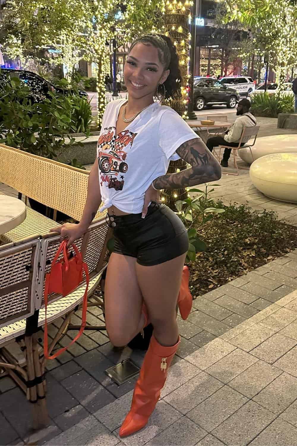 rap-concert-outfits-3 Graphic Tee and Knee-High Boots