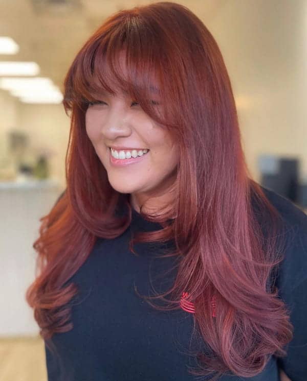 red-haircut-with-full-fringe-for-thick-hair Red Haircut with Full Fringe for Thick Hair