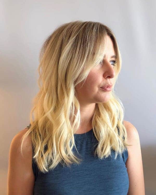 Soft Layered Wavy Haircut with Curtain Bangs