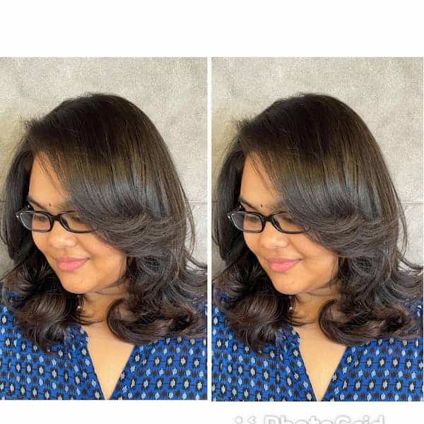 stylish-neck-length-haircut-with-curly-ends-and-feathered-layers Stylish Neck-Length Haircut with Curly Ends and Feathered Layers