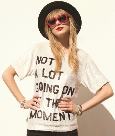 Taylor Swift wearing the infamous "not a lot going on at the moment" shirt.