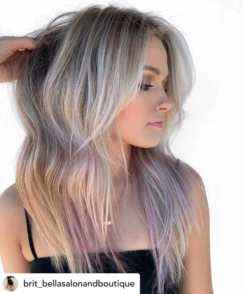 Long face-framing bangs on beautiful blonde and purple hair.