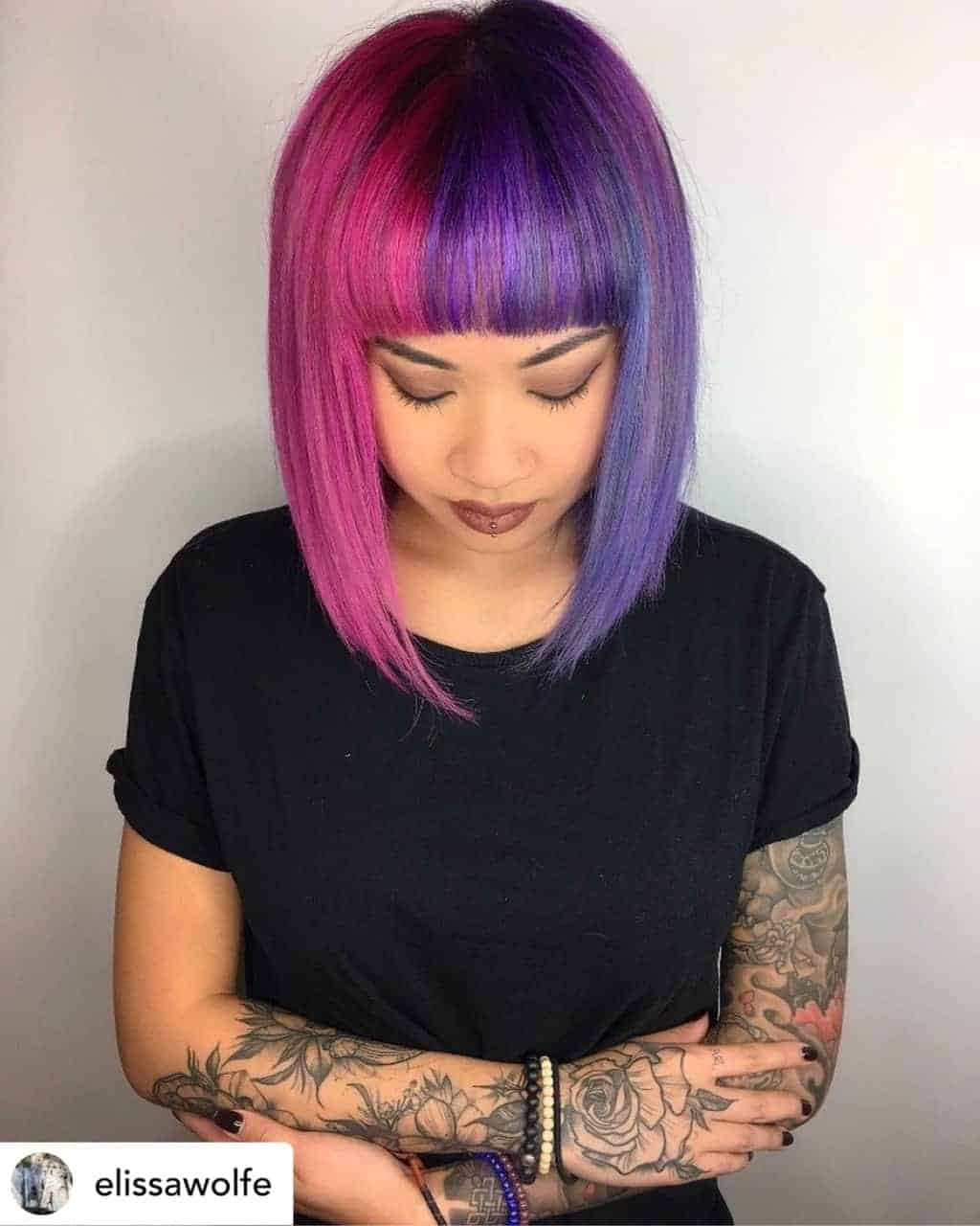 Blunt bangs on beautiful pink and purple hair.