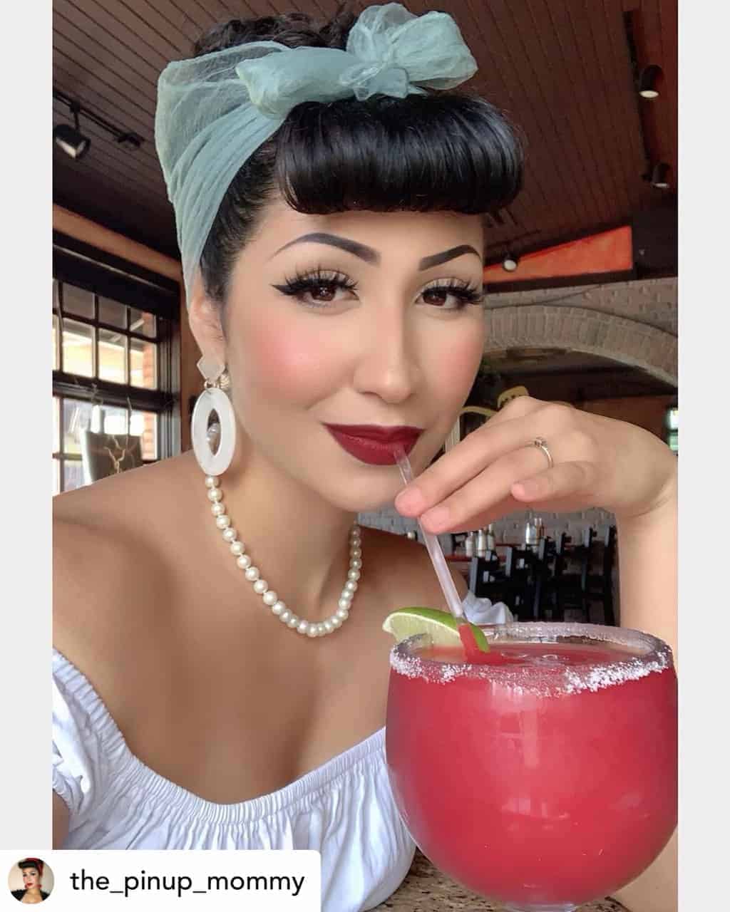 Pin-up girl bumper bangs on beautiful black hair.