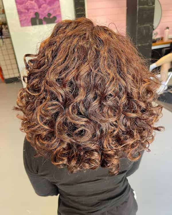 warm-copper-toned-hair-with-bold-curls Warm Copper-Toned Hair with Bold Curls